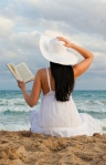 woman-reading-book-on-beach